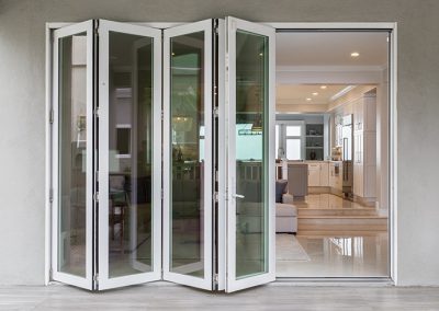 white-bifold-door-partially-open